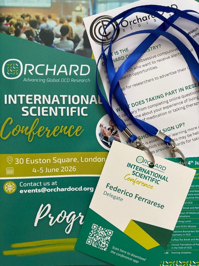Inside the Orchard OCD Conference 2026: Future Treatments. Federico Ferrarese's delegate badge and programme booklet at the Orchard OCD Conference 2026, 30 Euston Square, London.